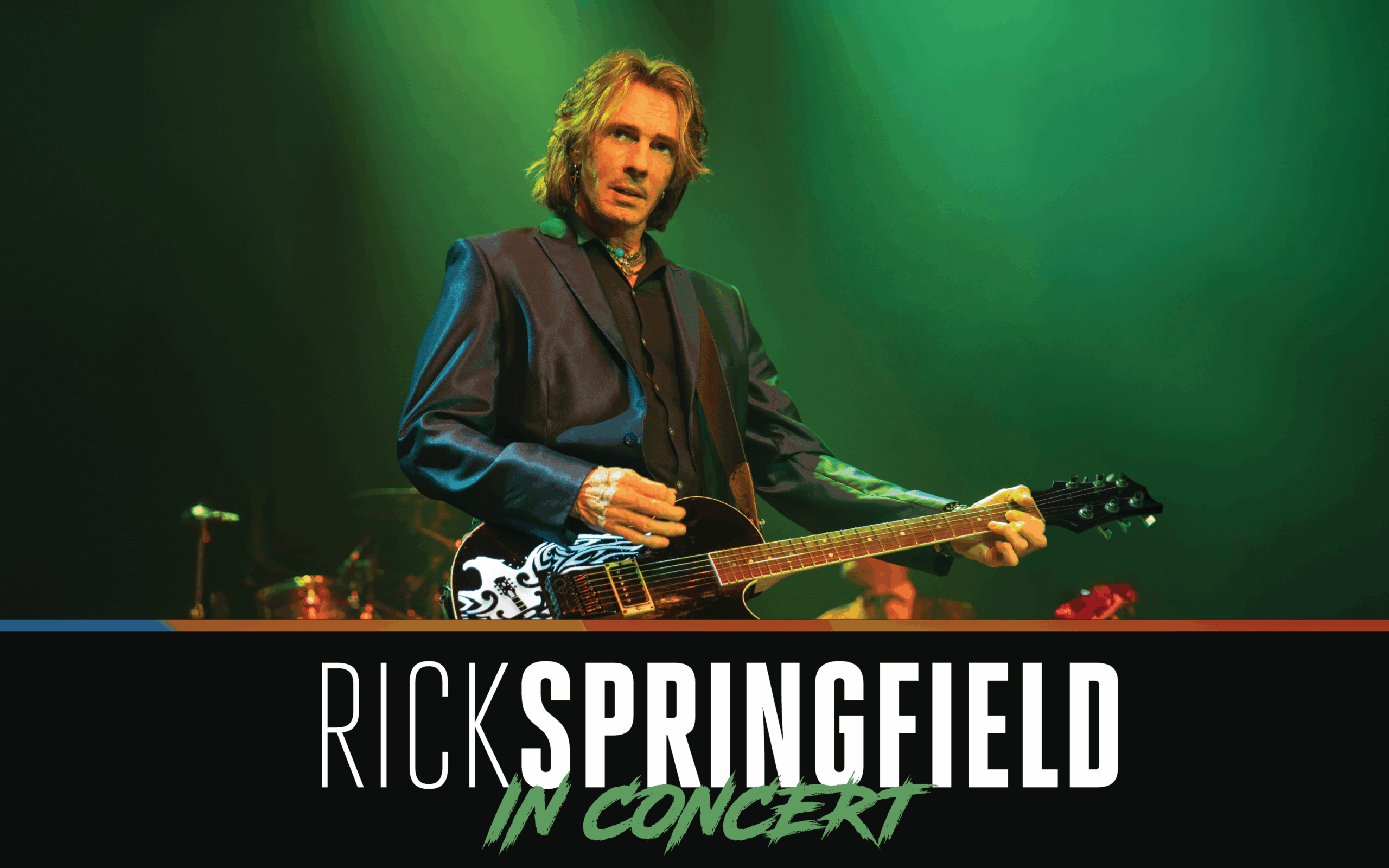 Rick Springfield performing live on stage with guitar under green lighting, with bold text below that reads “Rick Springfield In Concert.”