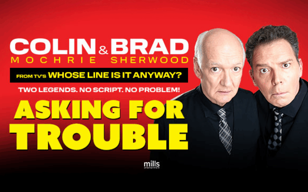 Promotional poster with a red background featuring comedians Colin Mochrie and Brad Sherwood. Large bold text reads: “Colin & Brad Mochrie Sherwood – From TV’s Whose Line Is It Anyway? Two Legends. No Script. No Problem! Asking for Trouble.”