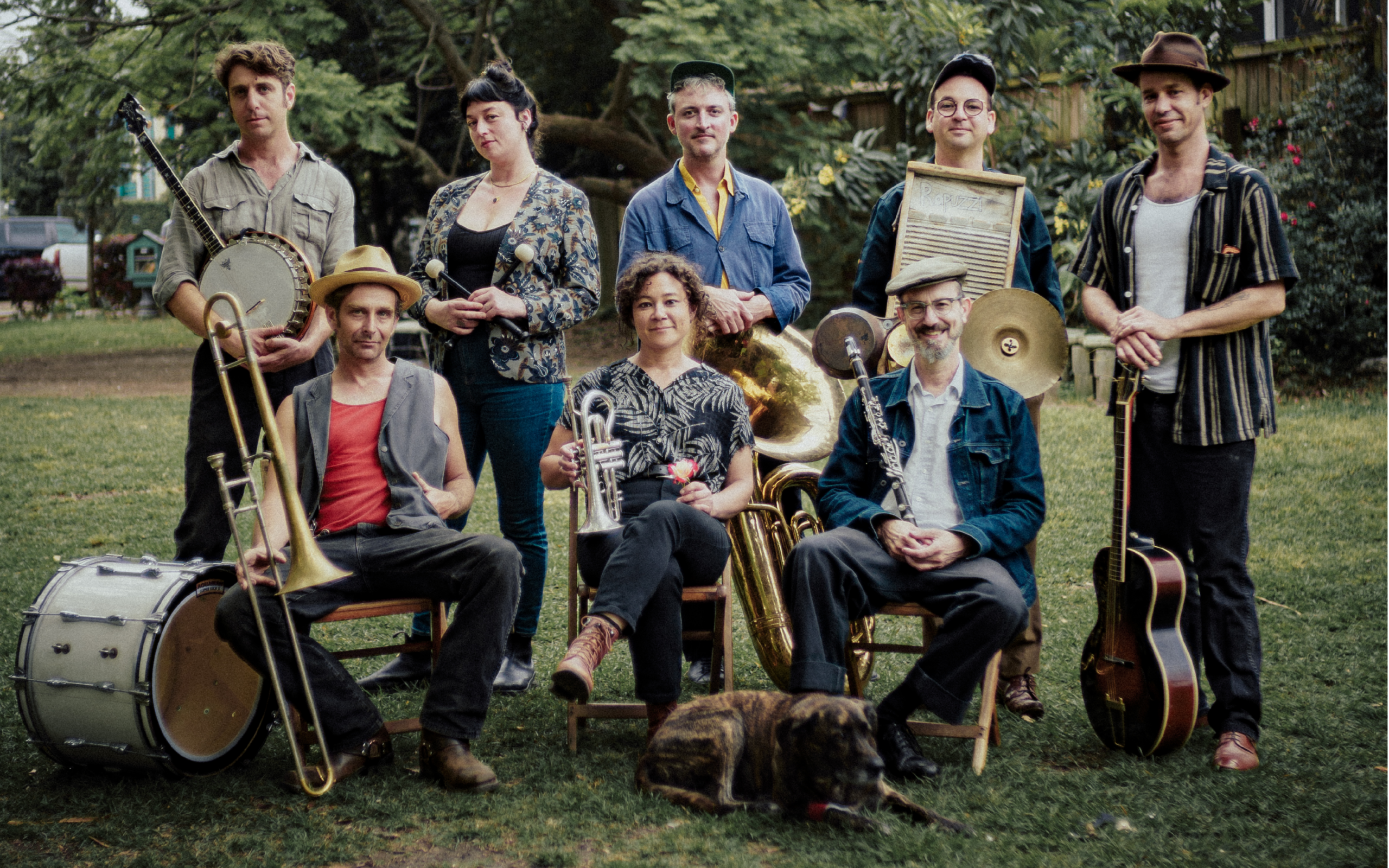 The members of Tuba Skinny posed outside with their instruments.