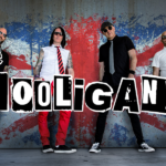 Promotional poster for The Hooligans. Pictured are band members posed in front of The Union Jack. It reads "The Hooligans."